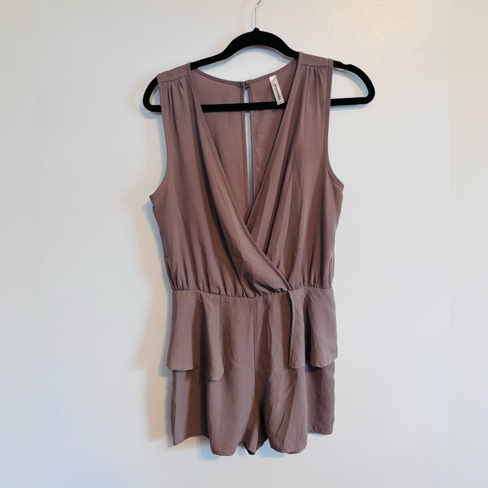 Peppermint dusty purple romper with ruffles at the hips and deep v in